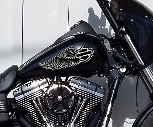 Close-up of silver leaf Harley-Davidson wing tank decals by Highway Division, hand-applied for a custom vintage look on a black fuel tank CVO Road Glide Bagger Dyna Sportster