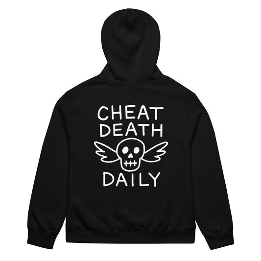 Person wearing a black hoodie with 'Cheat Death Daily' text in a store setting Highway Division HWY Motorcycle