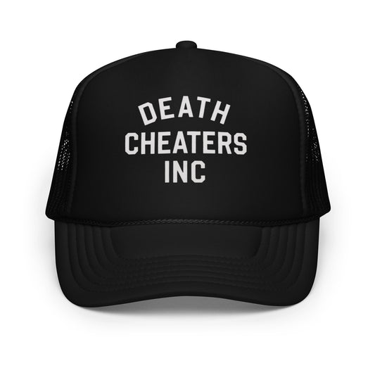 "Highway Division black trucker hat with bold DEATH CHEATERS INC text on the front, snapback cap with mesh back, designed for motorcycle riders, streetwear fans, and garage culture enthusiasts seeking edgy, rebellious headwear with a rugged, custom look