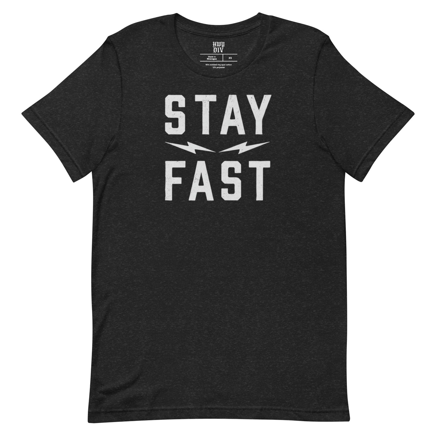 A black short-sleeve t-shirt from Highway Division, displayed flat against a neutral background. The shirt features a bold, minimalist front print in large, capitalized white letters that read “STAY FAST,” centered across the chest. The font is strong and modern, evoking speed and motion, with no other visible graphics, branding, or embellishments on the front or sleeves. The material appears soft and lightweight, likely 100% cotton, with a regular fit and classic crew neckline. There are no visible prints