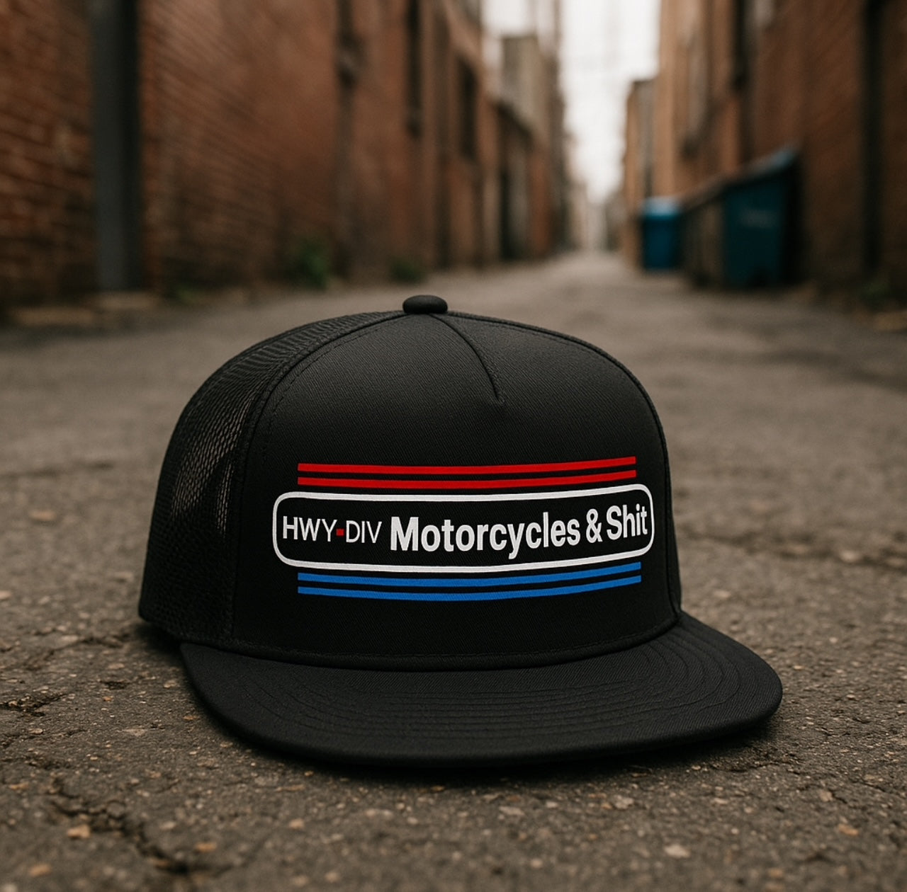 Highway Division trucker hat with 'Motorcycles and Shit' embroidered on the front in bold lettering. Designed with a vintage biker aesthetic, the cap reflects Harley-Davidson-inspired outlaw culture and a no-BS attitude