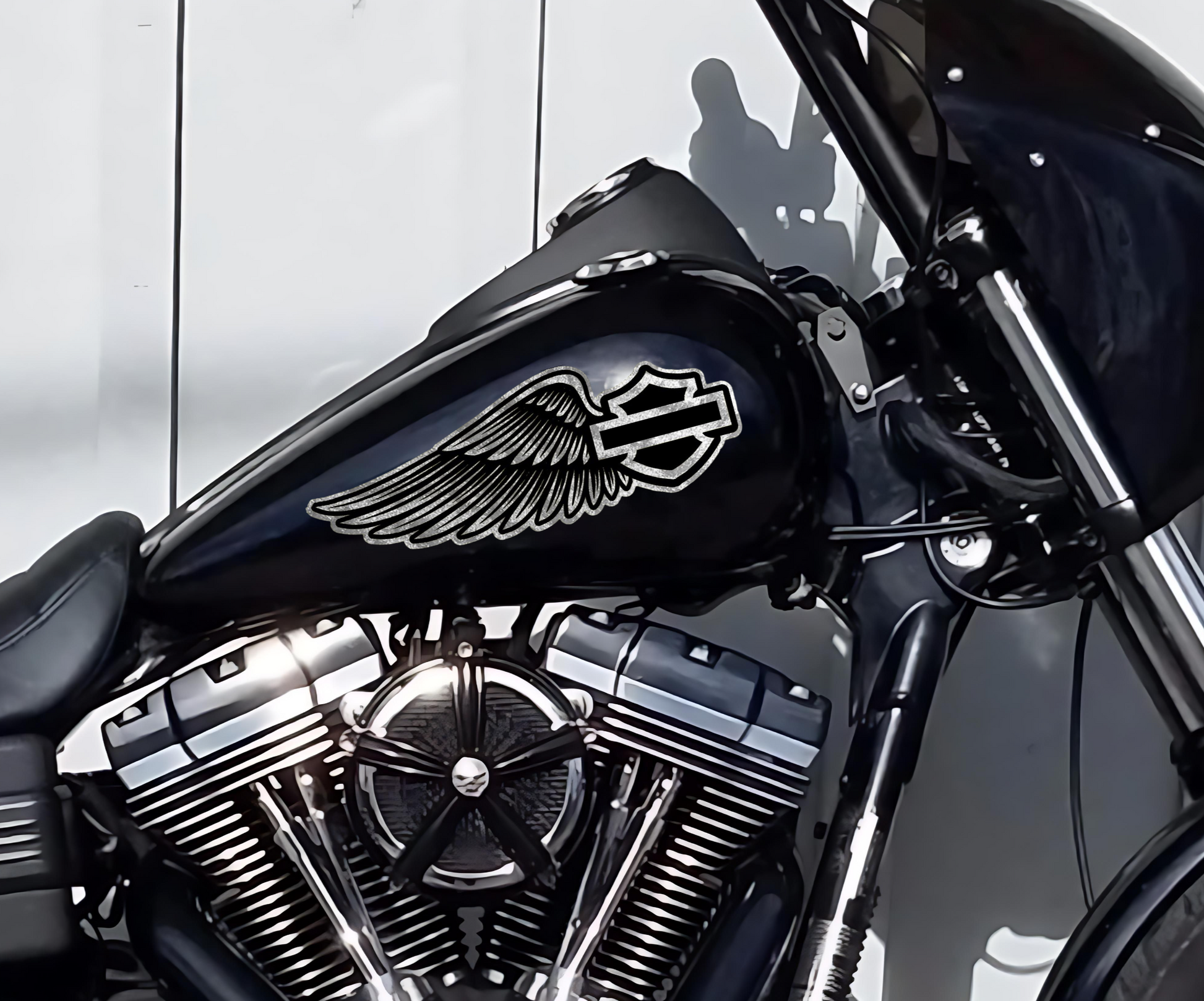 Close-up of silver leaf Harley-Davidson wing tank decals by Highway Division, hand-applied for a custom vintage look on a black fuel tank CVO Road Glide Bagger Dyna Sportster 