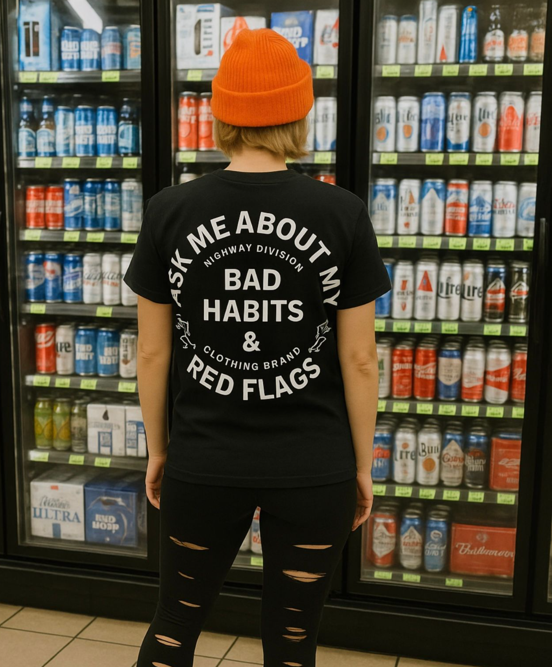 Black Highway Division T-shirt with bold white and red text that reads: 'Ask Me About My Bad Habits and Red Flags.' The design includes subtle motorcycle culture elements like a skull in a helmet, crossed wrenches, or exhaust pipes in the background. The font is gritty and distressed, giving the shirt a rebellious, biker-inspired edge.