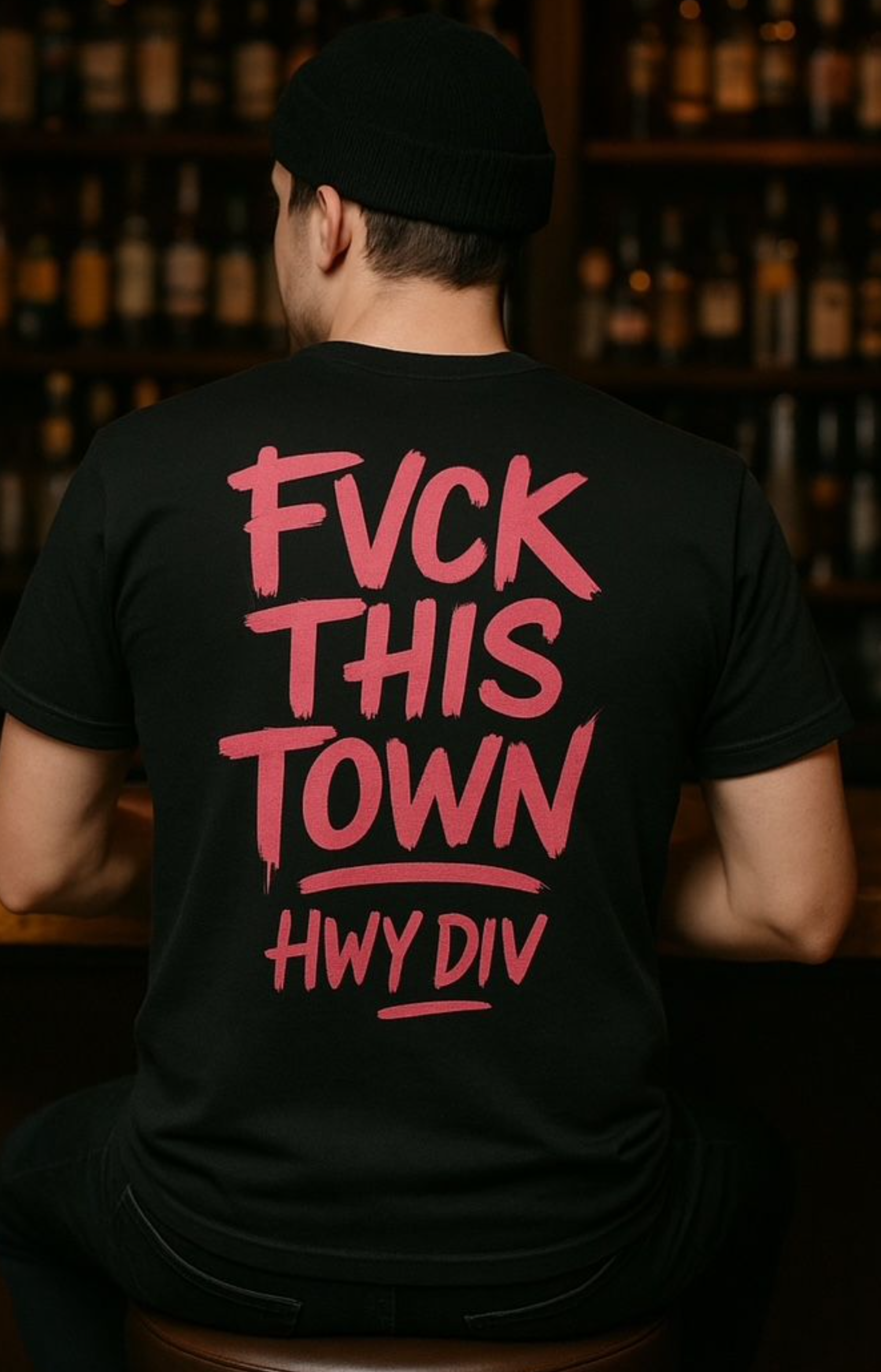Black T-shirt with bold, distressed white lettering across the chest that reads: 'FUCK THIS TOWN.' The design has a gritty, rebellious feel, reflecting Highway Division’s outlaw-inspired aesthetic, often associated with motorcycle and counterculture style