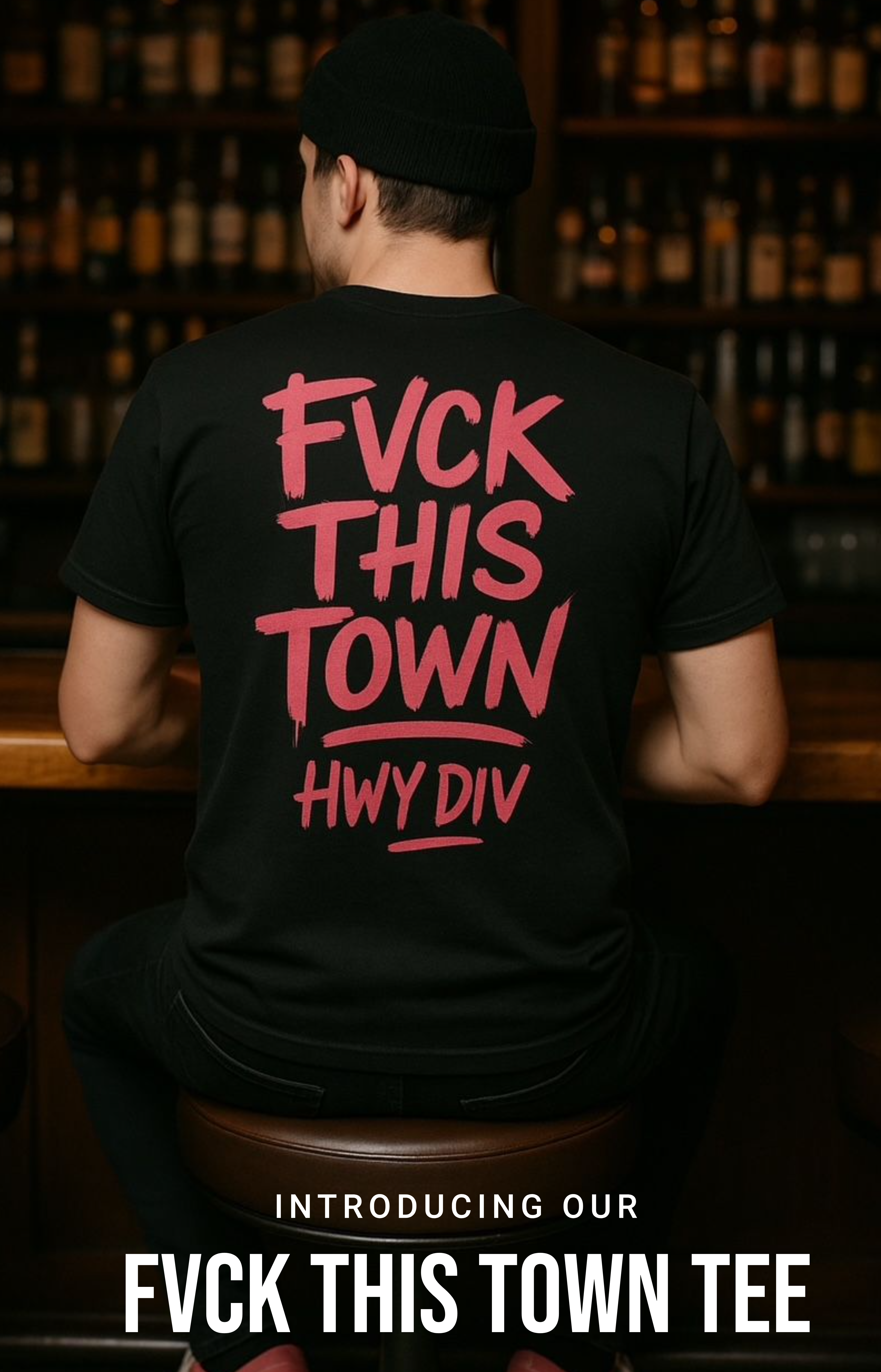 Black T-shirt with bold, distressed white lettering across the chest that reads: 'FUCK THIS TOWN.' The design has a gritty, rebellious feel, reflecting Highway Division’s outlaw-inspired aesthetic, often associated with motorcycle and counterculture style