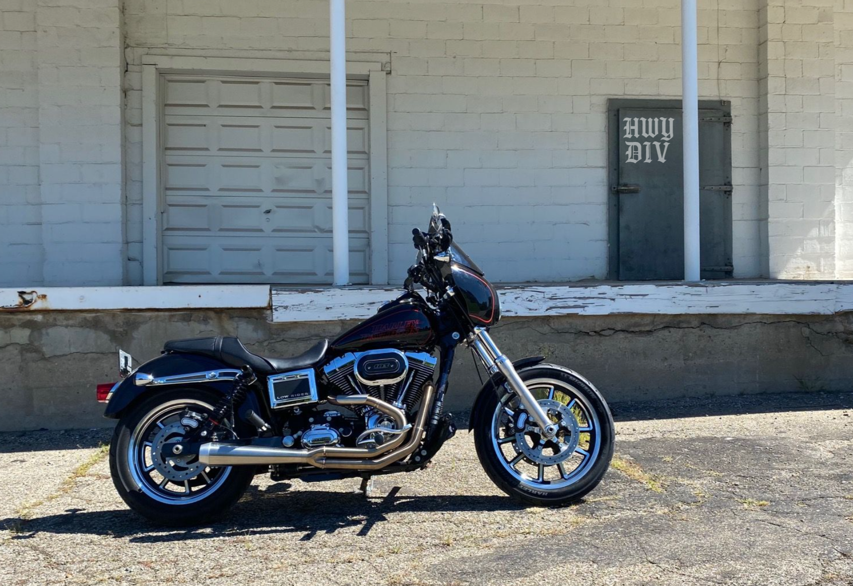 Bold Highway Division T-shirts, hoodies, and hats styled on a Harley-Davidson rider cruising the open road — premium gear for motorcycle enthusiasts who live for the ride