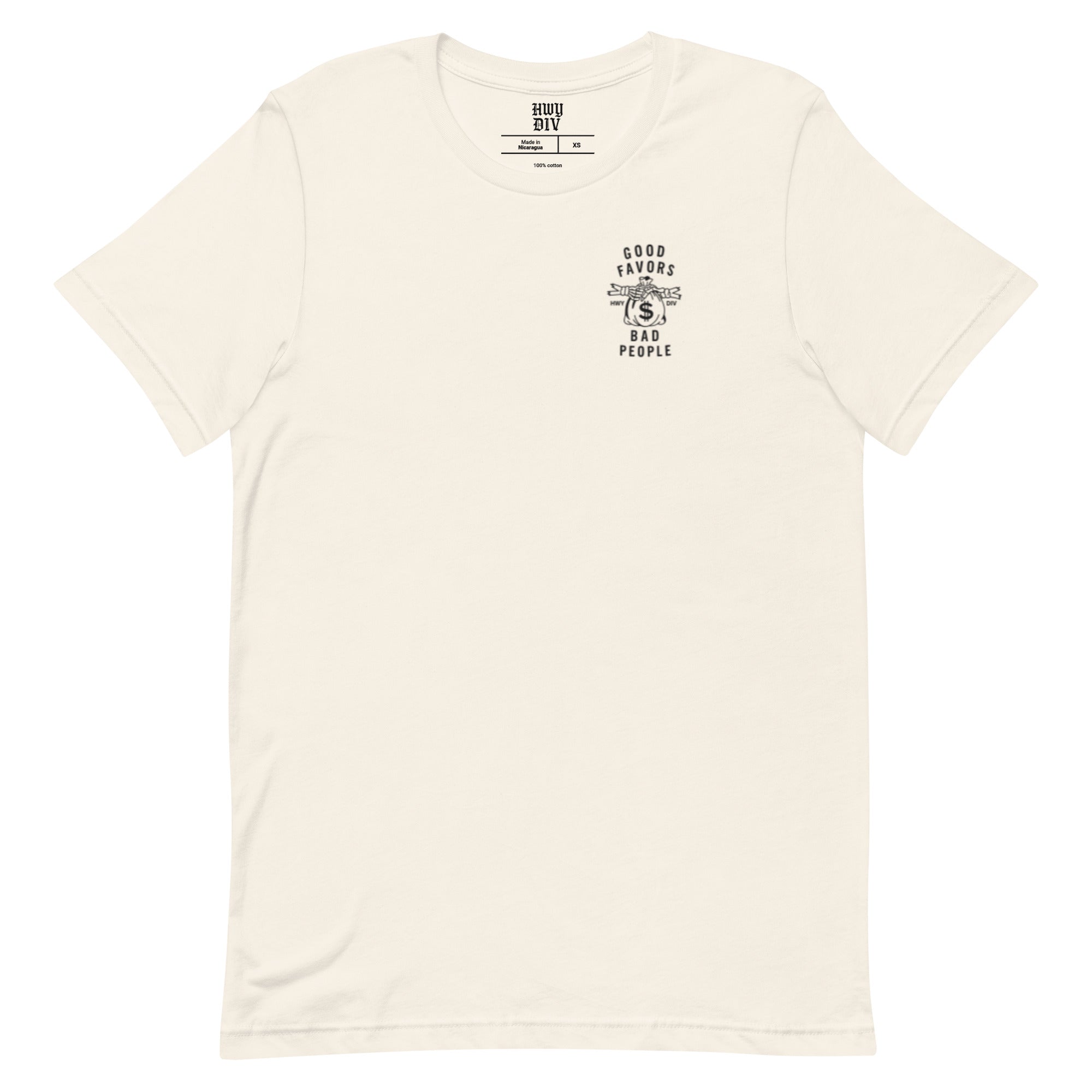 Model wearing vintage white Highway Division t-shirt with bold "GOOD FAVORS BAD PEOPLE" front print; rebellious streetwear with a gritty, anti-mainstream aesthetic.
